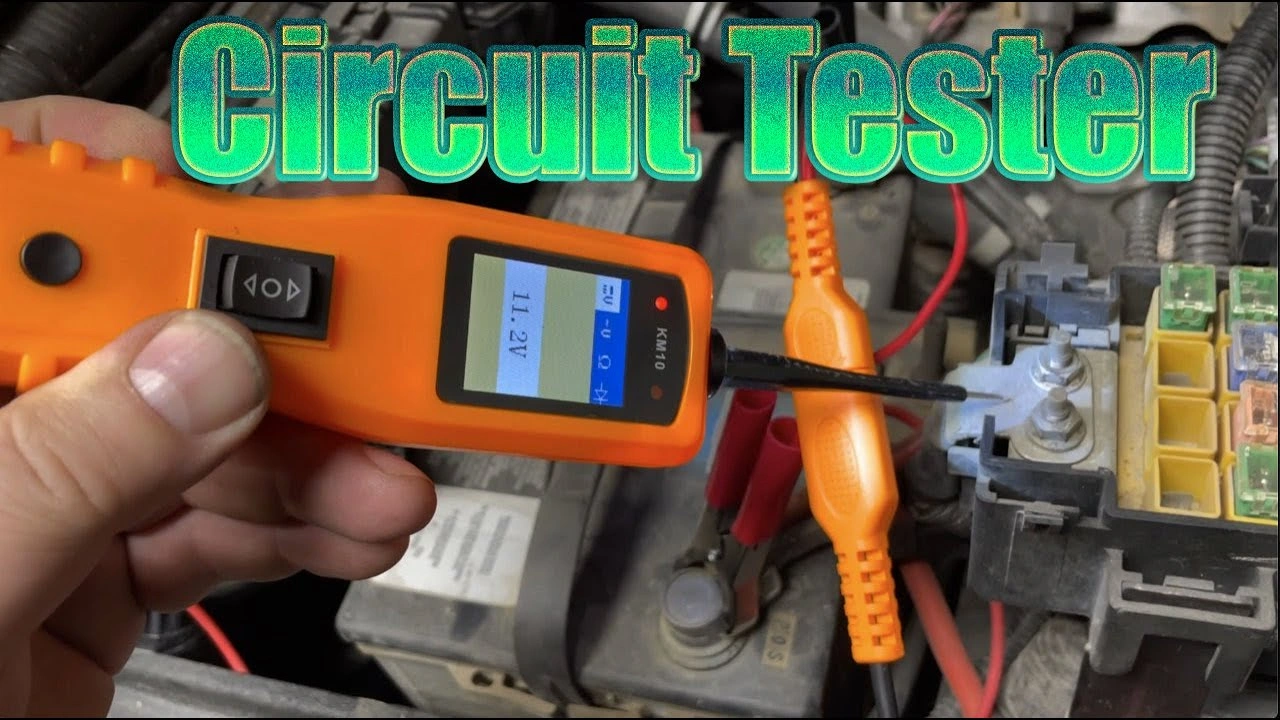 Battery charger connected to 12V equipment battery on workbench